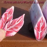 red Glitter polymer clay feather cane