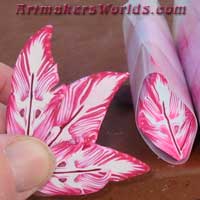 Hot pink red and white polymer clay feather cane