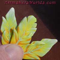 Canary orange polymer clay feather cane
