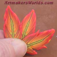 polymer clay feather cane hot pink and orange