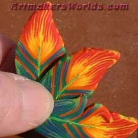 Flaming parrot feather polymer clay cane