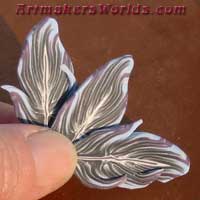 polymer clay feather cane Grey with purple and blue tips