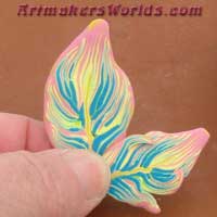 Pink Blue and yellow polymer clay feather cane