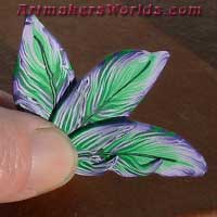Purple and green polymer clay feather cane