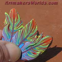 Rainbow multi color polymer clay feather cane